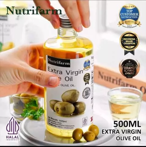 AI Video from prompt: "A hand gently holds a bottle of olive oil, then