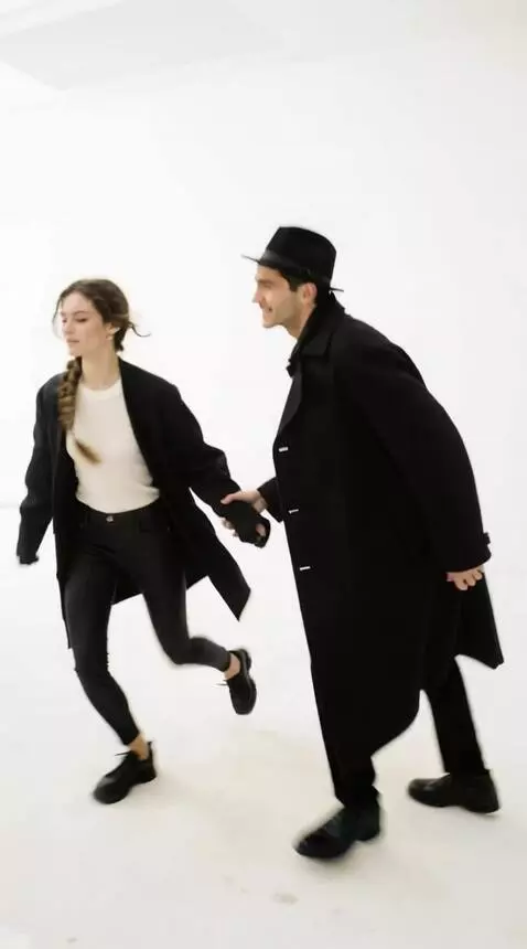 AI Video from prompt: A man takes a woman by the hand and they run out