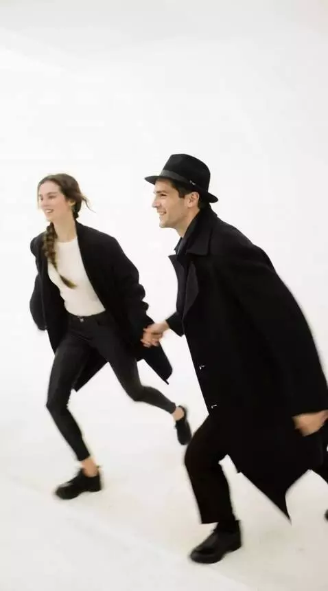 AI Video from prompt: A man takes a woman by the hand and they run out