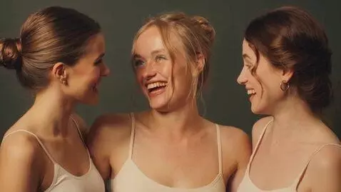AI Video from prompt: The three people start lauging.