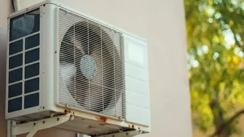 AI Video from prompt: a wall-mounted outdoor air conditioner unit, far