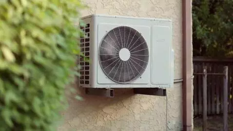 AI Video from prompt: a single wall-mounted outdoor AC unit, camera pl