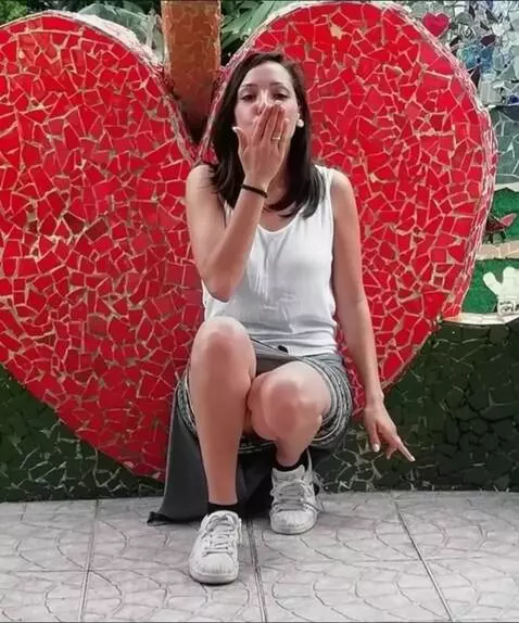 AI Video from prompt: blows a passionate kiss towards the camera