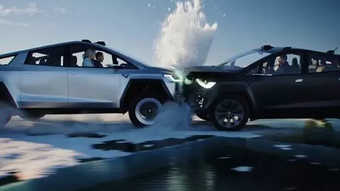 AI Video from prompt: 5‑second cinematic chase: silver vs black Tesla 