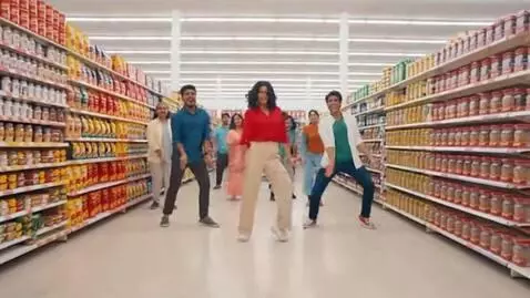 AI Video from prompt: Wide shot inside a typical Indian supermarket. O