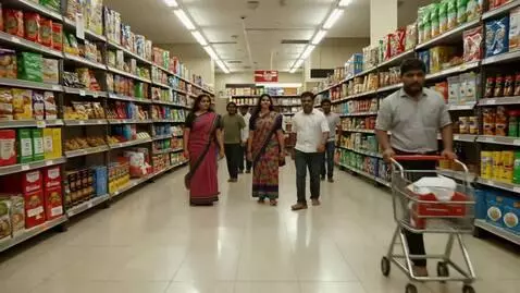 AI Video from prompt: Wide shot inside a typical Indian supermarket. O