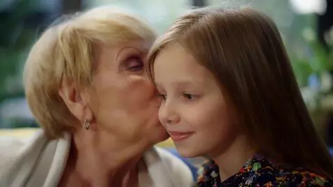 AI Video from prompt: old woman passionately kisses girl