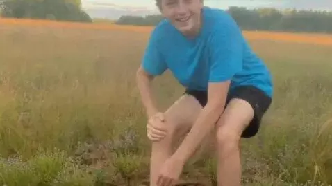 AI Video from prompt: he stands up and greets with a smile