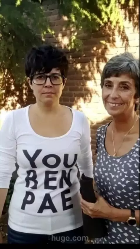 AI Video from prompt: Both women shows off her clothes.full body image