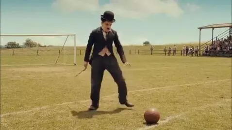 AI Video from prompt: Charlie Chaplin playing football