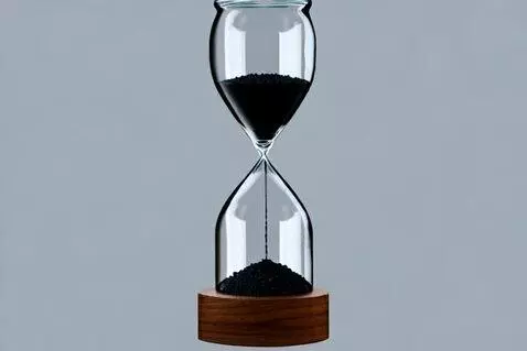 AI Video from prompt: **Subject:** A modern minimalist hourglass with 
