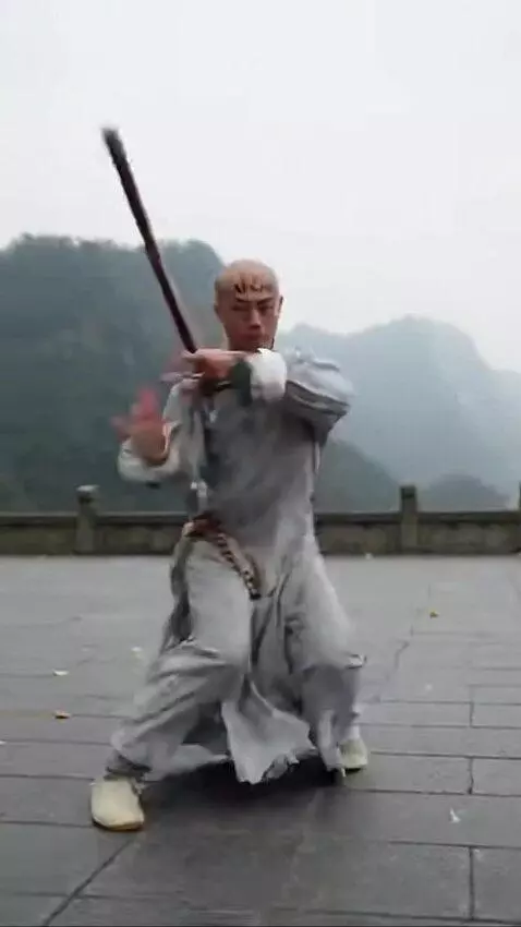 AI Video from prompt: chinese monk practicing. monk head written MICHI