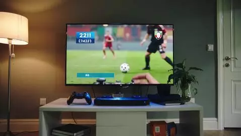 AI Video from prompt: playing Video game in house then goes to game on