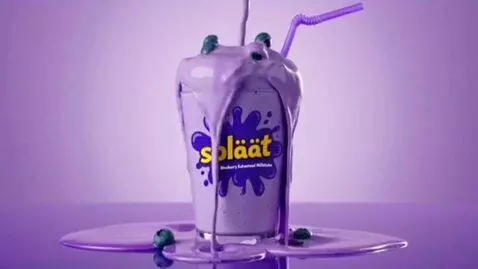 AI Video from prompt: splaat drinks blueberry flavored katwomeal milks