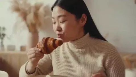 AI Video from prompt: a montage of a slim Korean model. she eats and g