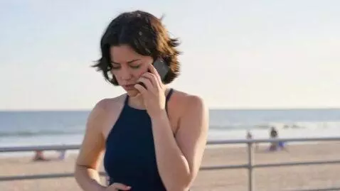 AI Video from prompt: Erin is having a pleasant day at the beach when 