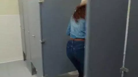 AI Video from prompt: COWGIRL JEANS AND COWGIRL BOOTS RAN TO THE TOILE