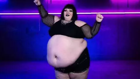 AI Video from prompt: a fat goth woman,she is wrating a crop top and s