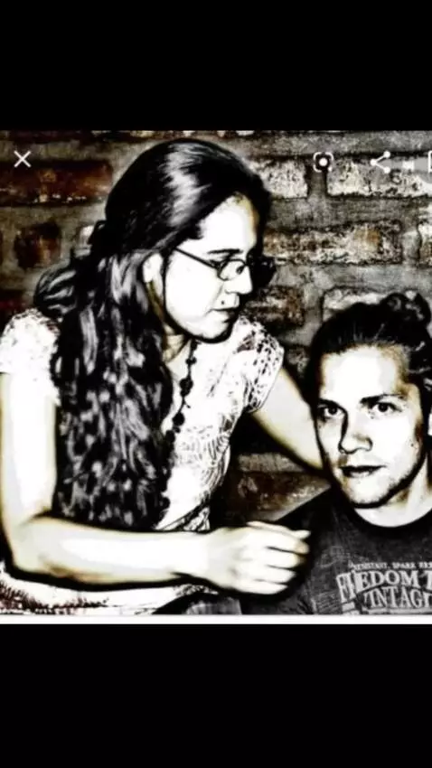 AI Video from prompt: The woman sits on her boyfriend and hugs him