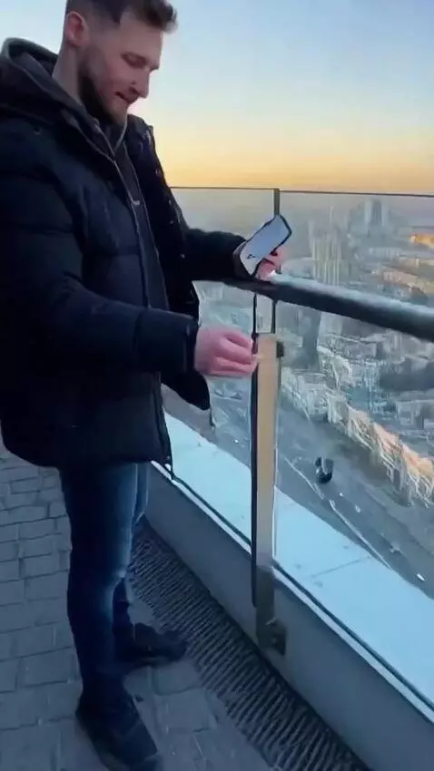 AI Video from prompt: some guy throws his NOKIA 3310 phone from the 10