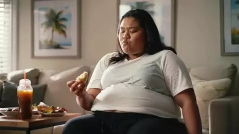 AI Video from prompt: a chubby Philippine TikTok star. she is trying a