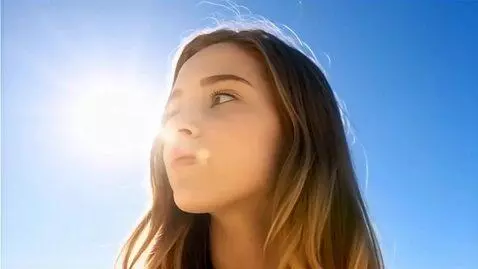 AI Video from prompt: Image of the serene face of a young woman. She l