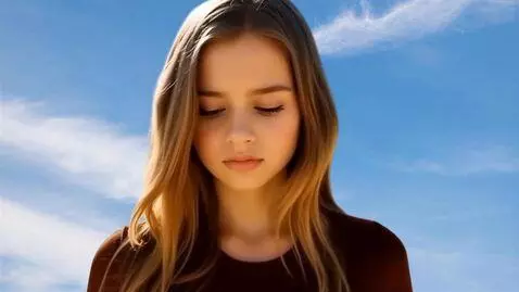 AI Video from prompt: Image of the serene face of a young woman. She l