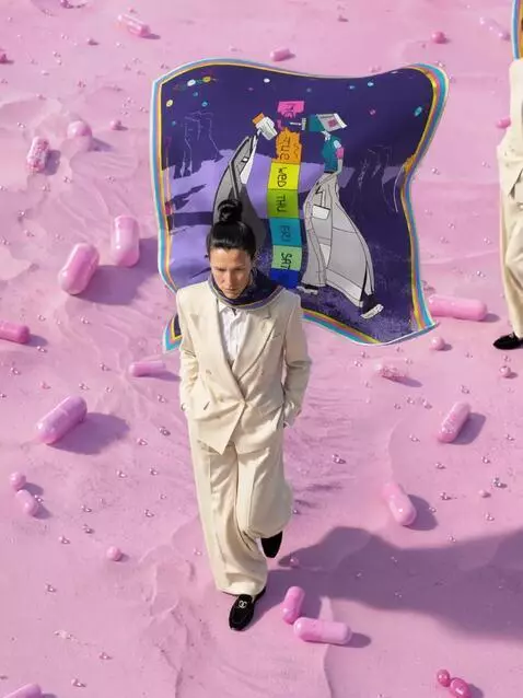AI Video from prompt: She walks slowly through the pink desert and her