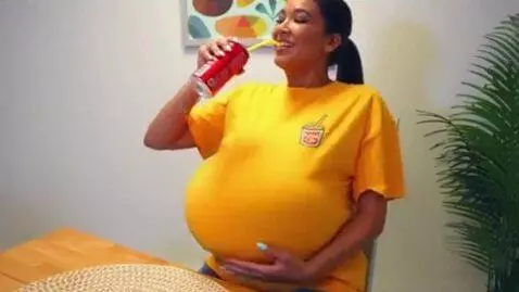 AI Video from prompt: a sketch comedy clip. an Indian woman drinks a s