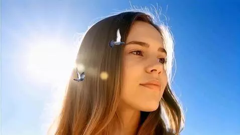 AI Video from prompt: Image of the serene face of a giant young woman.