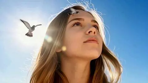AI Video from prompt: Image of the serene face of a giant young woman.