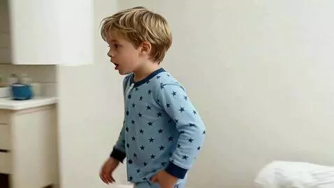 AI Video from prompt: He wakes up in the morning in bed and goes to th