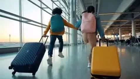 AI Video from prompt: an video of two kids running through an airport 