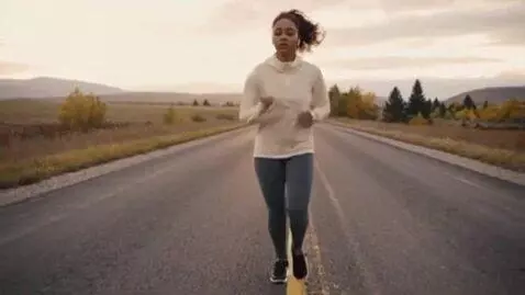 AI Video from prompt: A GIRL IS RUNNING  ON ROAD