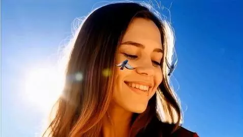AI Video from prompt: A young giant woman smiles at two tiny doves fly
