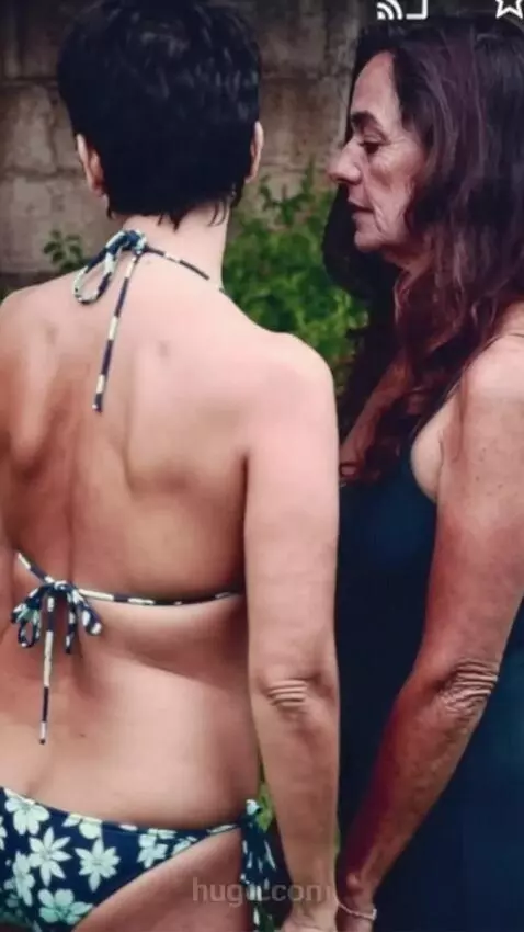 AI Video from prompt: The woman in bikini turns around and shows off h