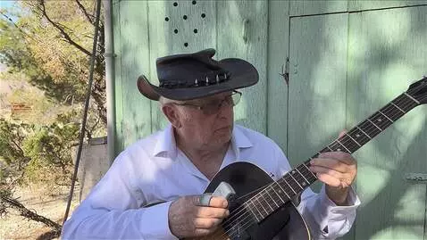 AI Video from prompt: he is not strumming  his right arm  is delicatel