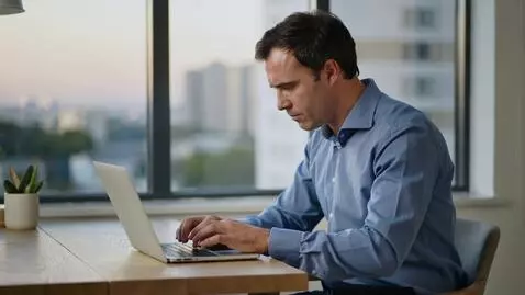 AI Video from prompt: A man is working on his laptop