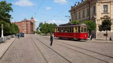 AI Video from prompt: An old tram runs through the city in 1930