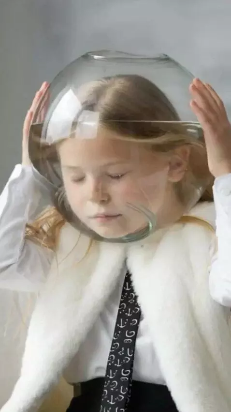 AI Video from prompt: A girl with her eyes closed put a transparent ro