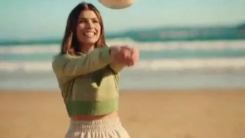 AI Video from prompt: A 19 yo skinny woman playing volleyball with a 2