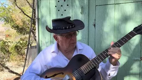 AI Video from prompt: the guitarist plays slow legato notes his right 