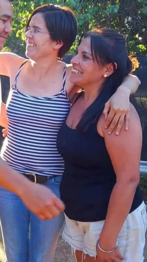 AI Video from prompt: A swinger husband hugs the two women