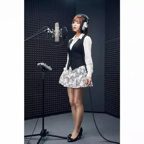 AI Video from prompt: A woman with headphones is singing.  The camera 