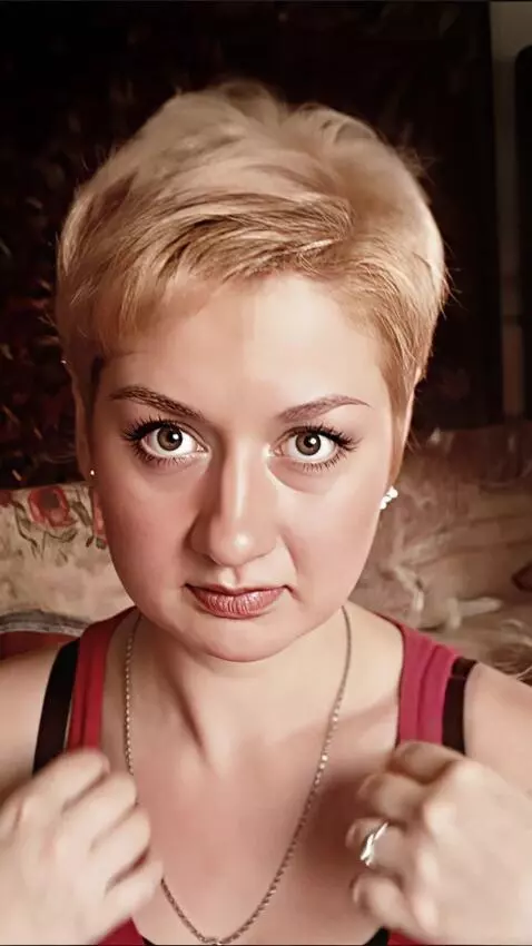 AI Video from prompt: woman tries on a tank top