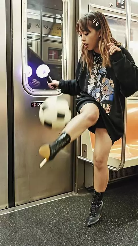AI Video from prompt: A soccer player in a dress kicks a ball in a sub