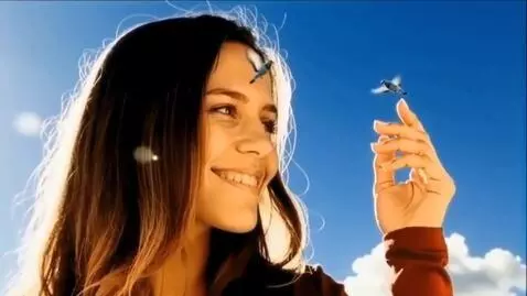 AI Video from prompt: A giant young woman smiles at two tiny doves fly