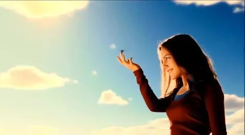 AI Video from prompt: A giant young woman smiles at two tiny doves fly