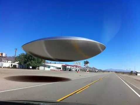 AI Video from prompt: a shiny metalic saucer shaped crant lands in the