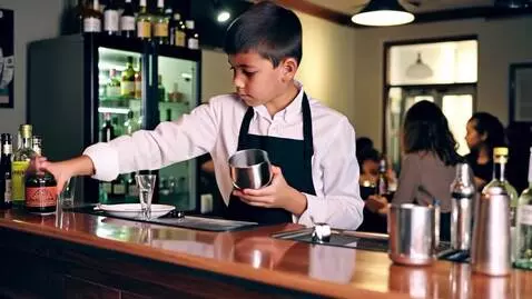 AI Video from prompt: a yong boy working as a making cocktails